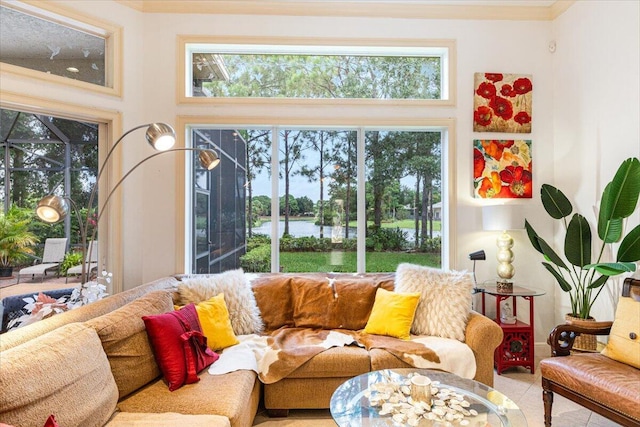 living room featuring light tile patterned floors and crown molding