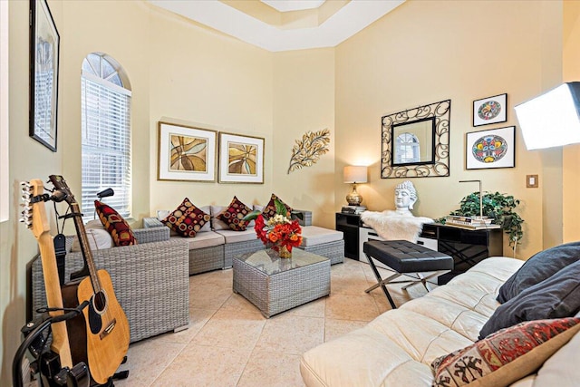 living room featuring a towering ceiling