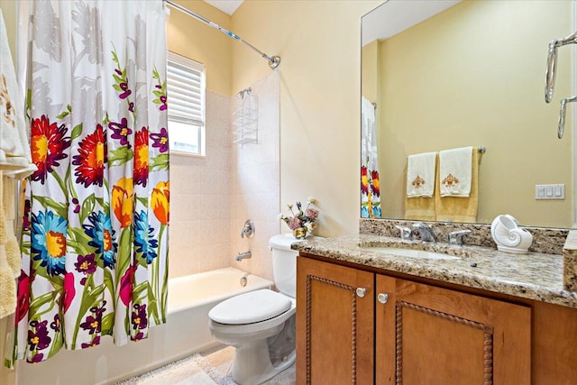 full bathroom featuring toilet, vanity, and shower / tub combo with curtain