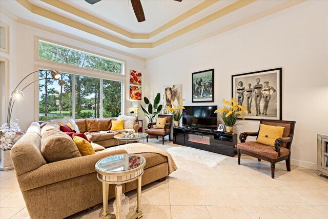 living room with ceiling fan and light tile patterned floors