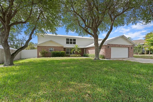 view of front of house with a garage and a front yard