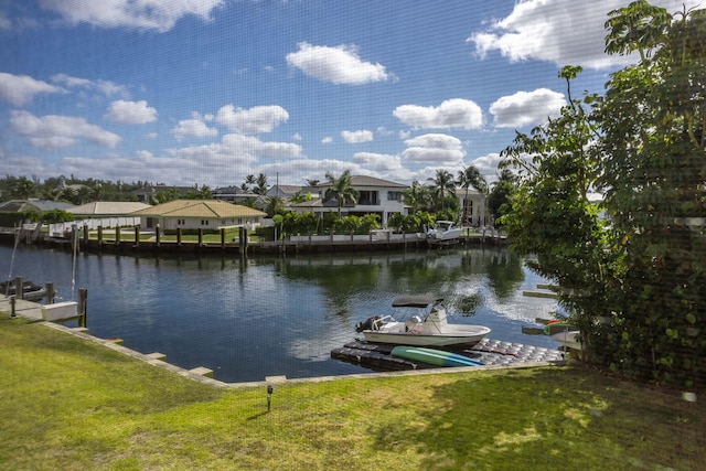 dock area featuring a water view and a yard