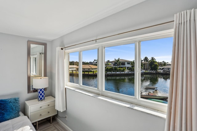 bedroom featuring a water view