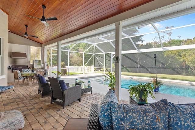 view of patio / terrace featuring outdoor lounge area, glass enclosure, and ceiling fan