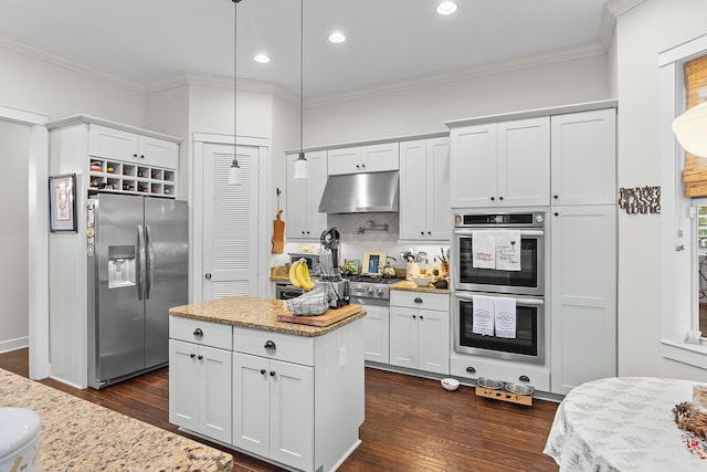 kitchen with white cabinetry, light stone countertops, hanging light fixtures, dark hardwood / wood-style flooring, and appliances with stainless steel finishes