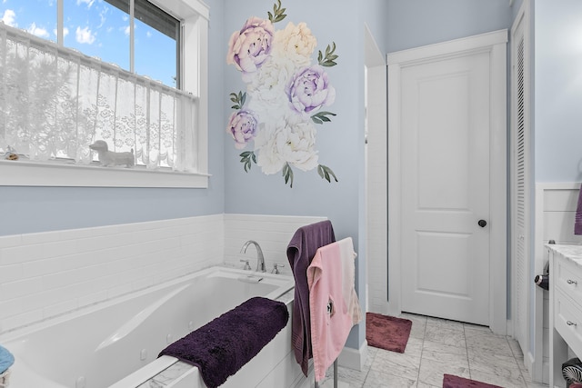 bathroom featuring vanity and a bathing tub