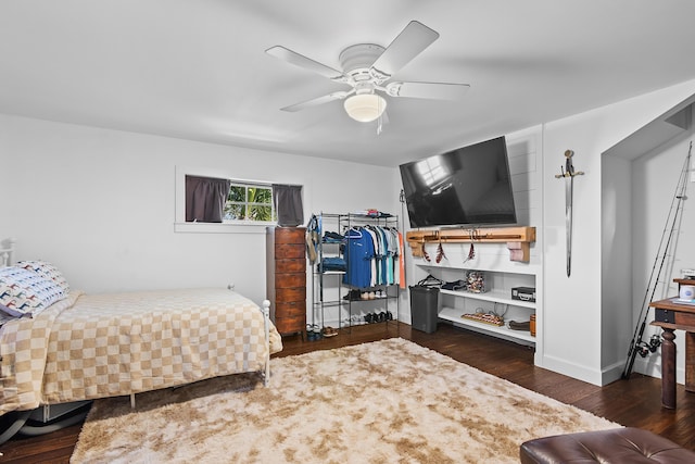 bedroom with ceiling fan and dark wood-type flooring