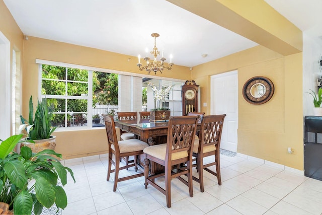 dining room featuring light tile patterned floors and a notable chandelier