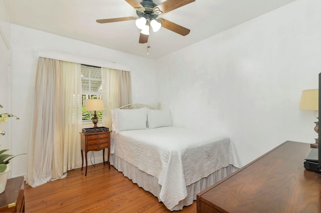 bedroom featuring wood-type flooring and ceiling fan