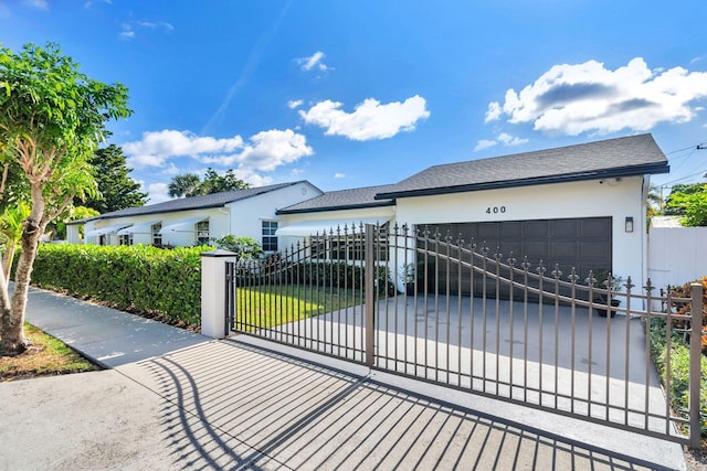 view of gate featuring a garage