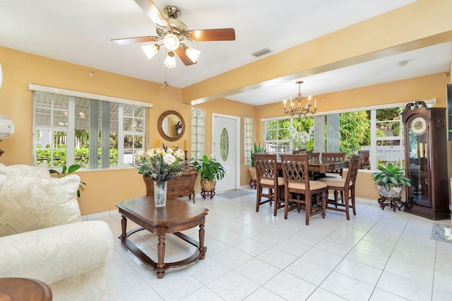 dining area featuring light tile patterned floors, ceiling fan with notable chandelier, and a wealth of natural light