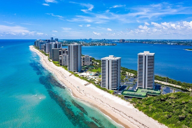 bird's eye view with a water view and a beach view