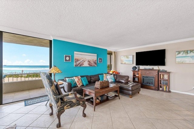 tiled living room with a textured ceiling, a water view, and crown molding