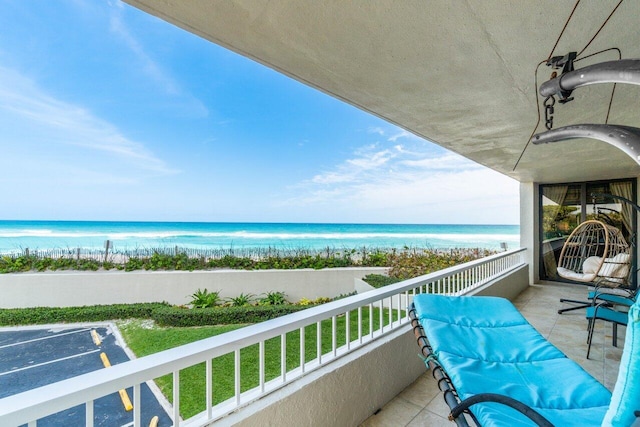 balcony featuring a water view