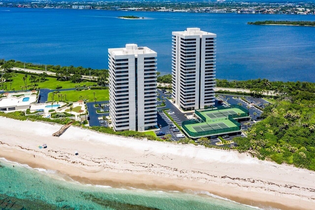 drone / aerial view with a water view and a view of the beach