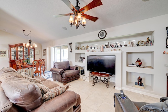 living room with ceiling fan with notable chandelier, built in features, light tile patterned floors, and lofted ceiling