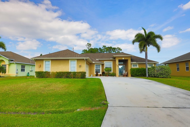 single story home with a front lawn