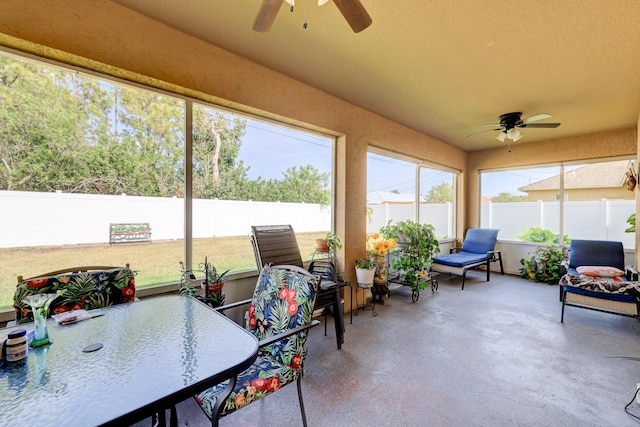 sunroom with plenty of natural light and ceiling fan