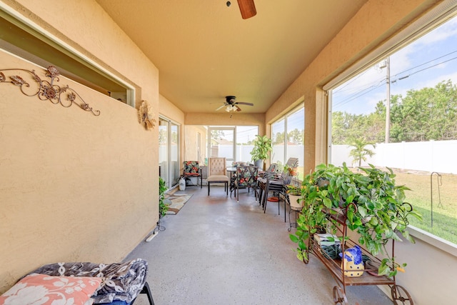 sunroom with ceiling fan