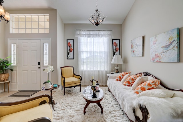 tiled living room with an inviting chandelier and a healthy amount of sunlight