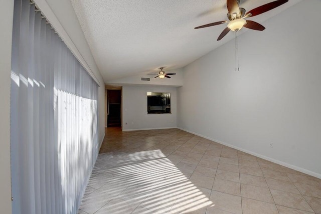 spare room with ceiling fan, light tile patterned flooring, and high vaulted ceiling