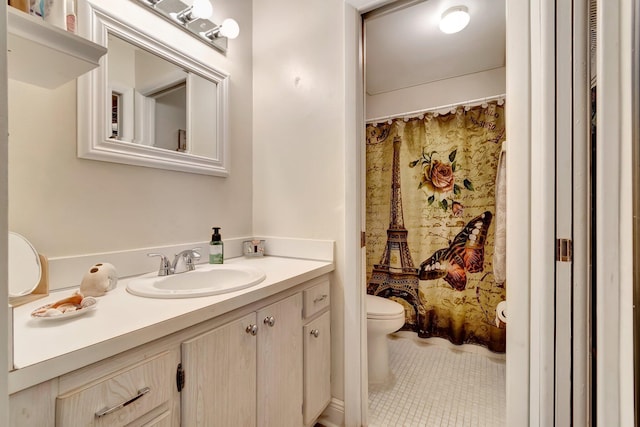 bathroom with curtained shower, tile patterned flooring, vanity, and toilet