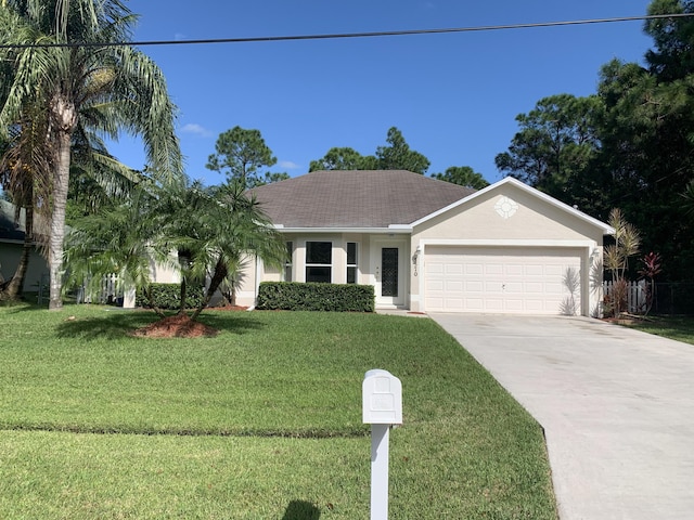 ranch-style house with a garage, a shingled roof, driveway, stucco siding, and a front yard