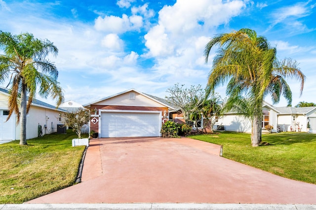 ranch-style home with an attached garage, concrete driveway, central AC, and a front yard