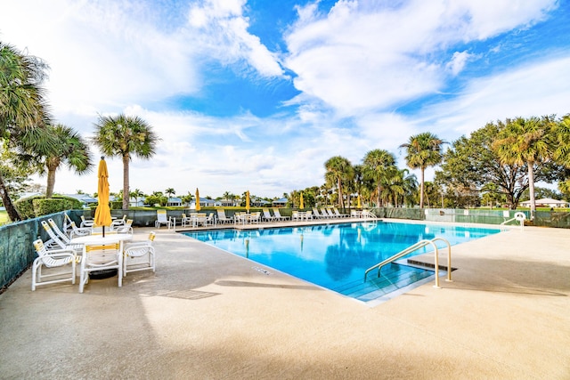 view of swimming pool with a patio