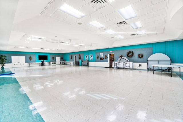 interior space with visible vents, a drop ceiling, and tile patterned floors