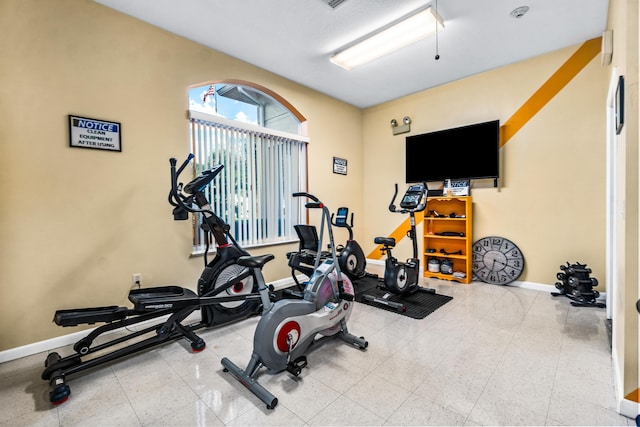 exercise room with baseboards