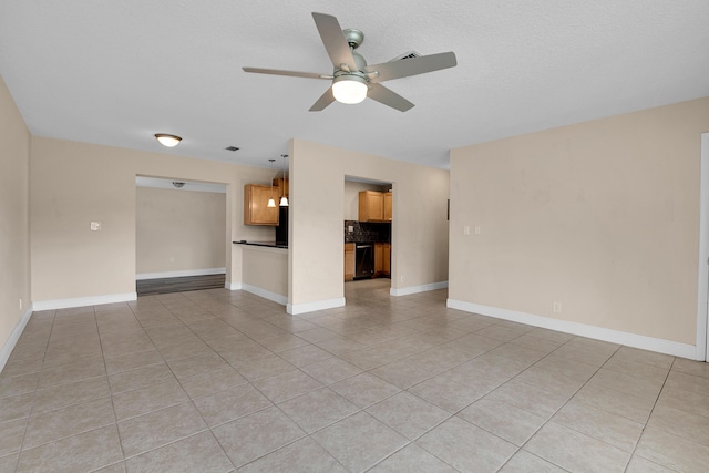 unfurnished living room featuring light tile patterned floors and ceiling fan