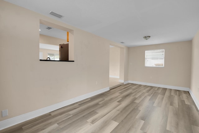 empty room with light wood-type flooring