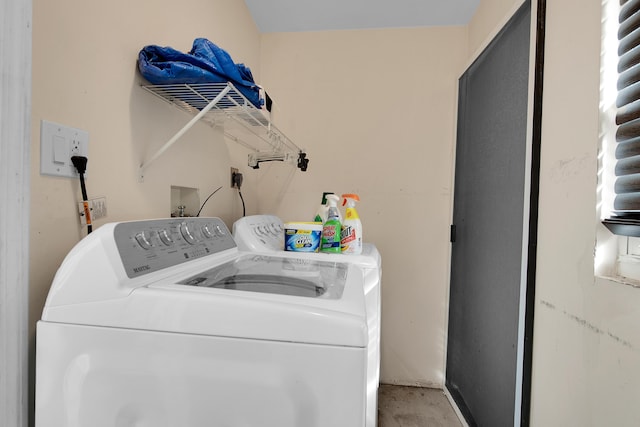 laundry room with washing machine and clothes dryer