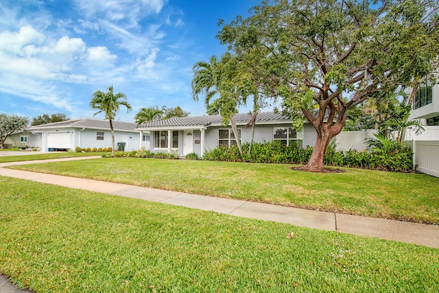 ranch-style home with a front yard