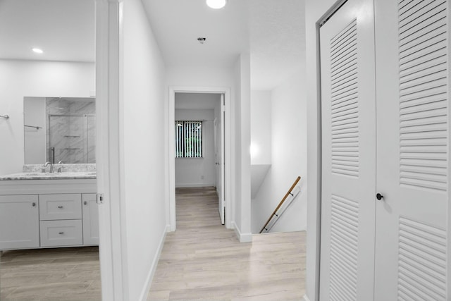 hall with light hardwood / wood-style floors