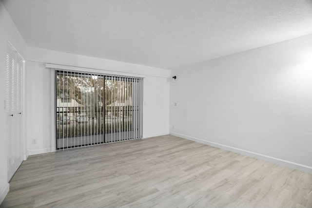 empty room with light wood-type flooring