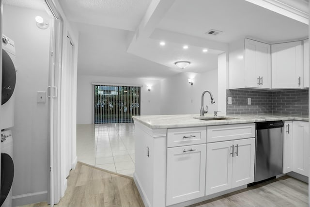 kitchen featuring dishwasher, white cabinetry, and sink