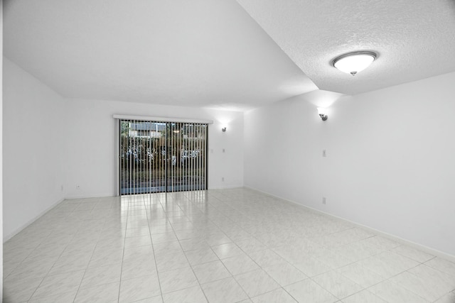 empty room with a textured ceiling