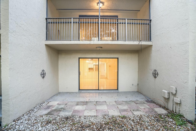 doorway to property featuring a patio area