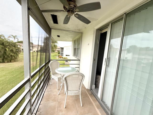 sunroom / solarium with ceiling fan