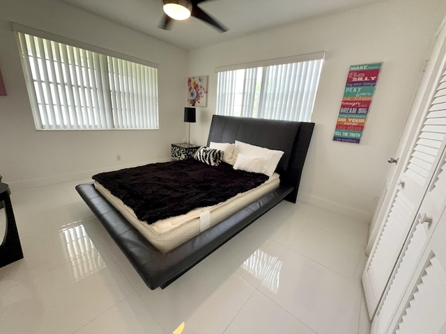 bedroom featuring ceiling fan and light tile patterned flooring