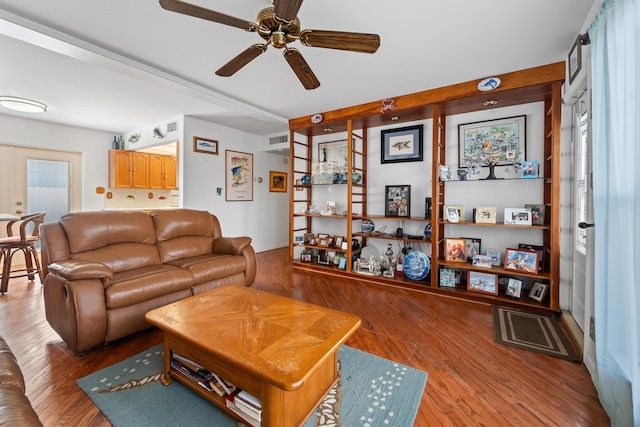 living room with ceiling fan and light wood-type flooring