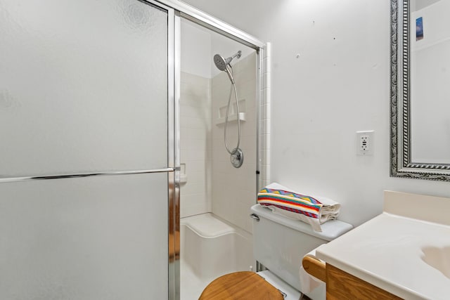 bathroom with vanity, toilet, and walk in shower