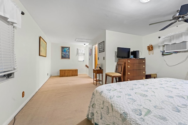 bedroom featuring light carpet, a wall mounted air conditioner, and ceiling fan