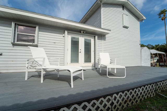 wooden deck featuring french doors