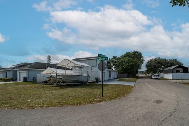 view of side of property featuring a yard