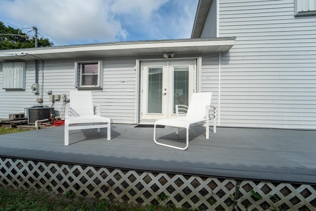 wooden deck with french doors and central AC unit