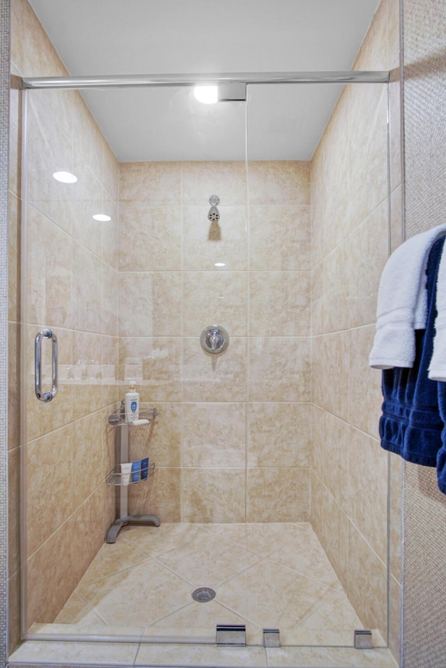 bathroom with a shower with shower door