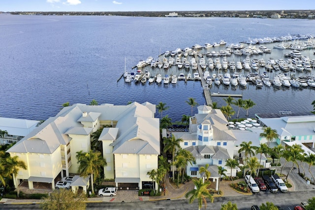 birds eye view of property with a water view